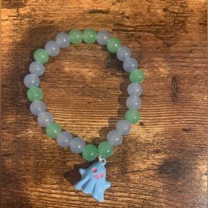 NEW HANDMADE GLASS BEAD BRACELET WITH BLUE GHOST CHARM